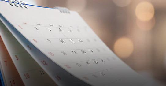 Close-up of a calendar on a desk
